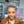 Bequeen Perruque “Chioma” Pixie marron ou gris curly avec lace frontale